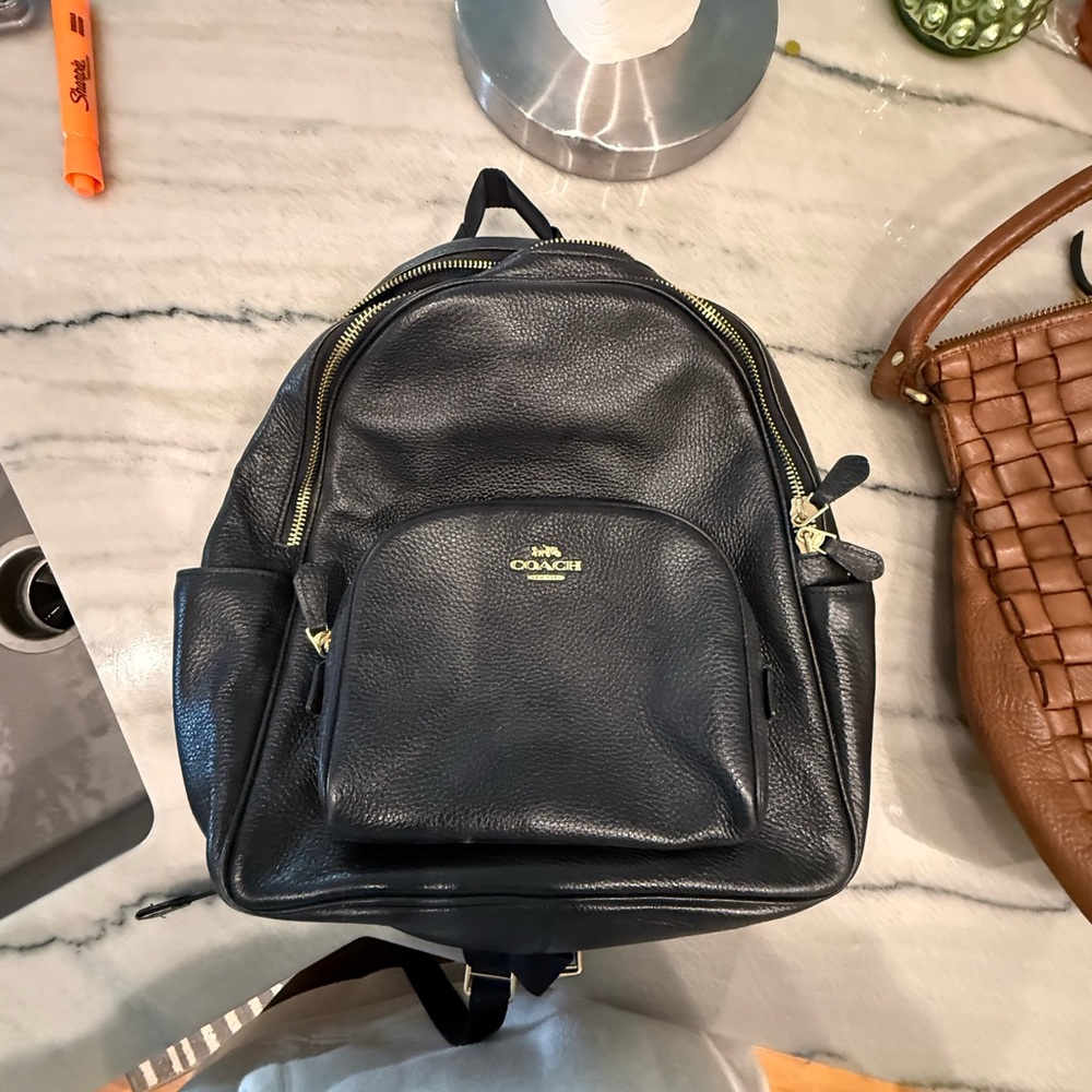 Coach Dark Leather Backpack with Gold Accents